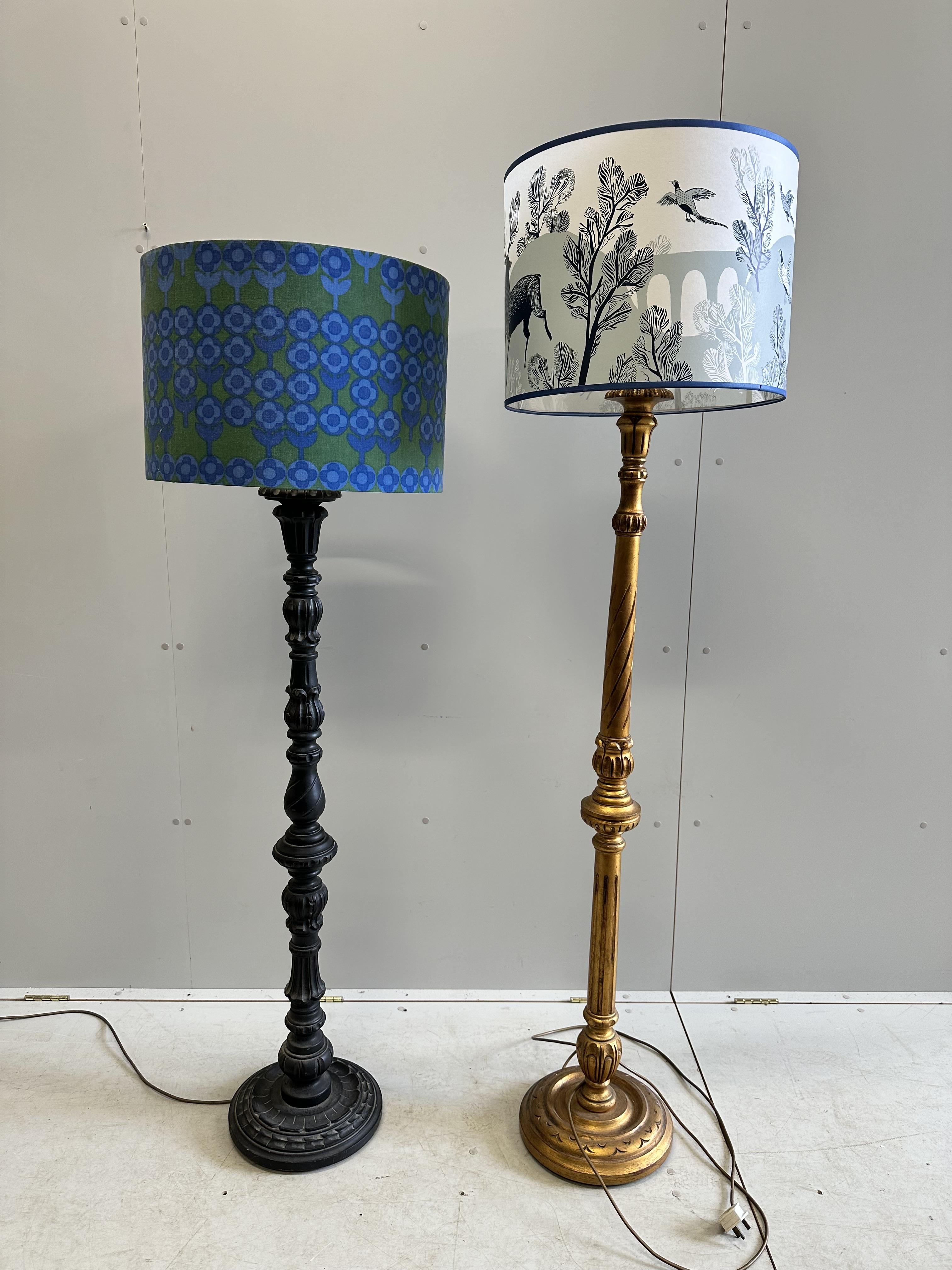 A Victorian style painted standard lamp and shade together with a giltwood standard lamp with shade, larger height 178cm